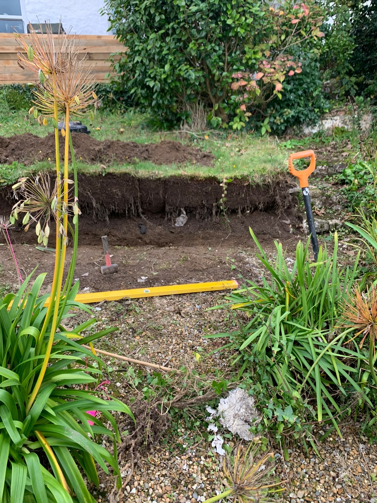 Turf stripped and the bank cut back to form the lower level