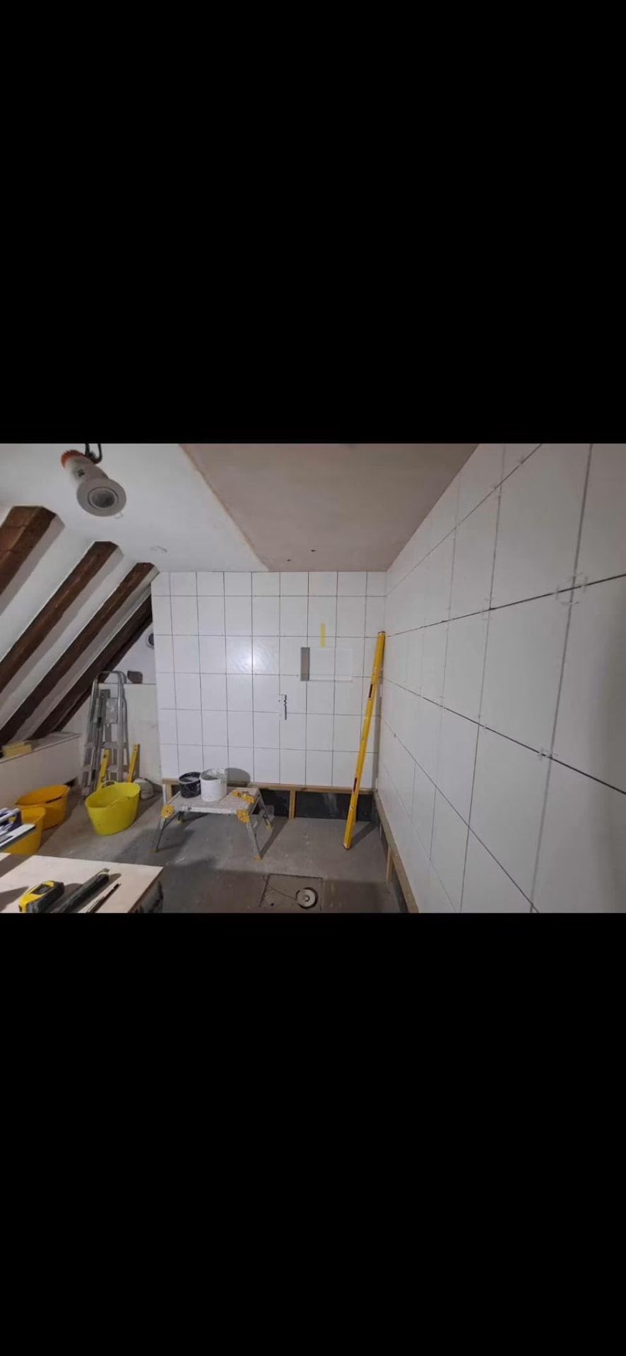 Wall tiling underway in the new ensuite over the tanked substrate