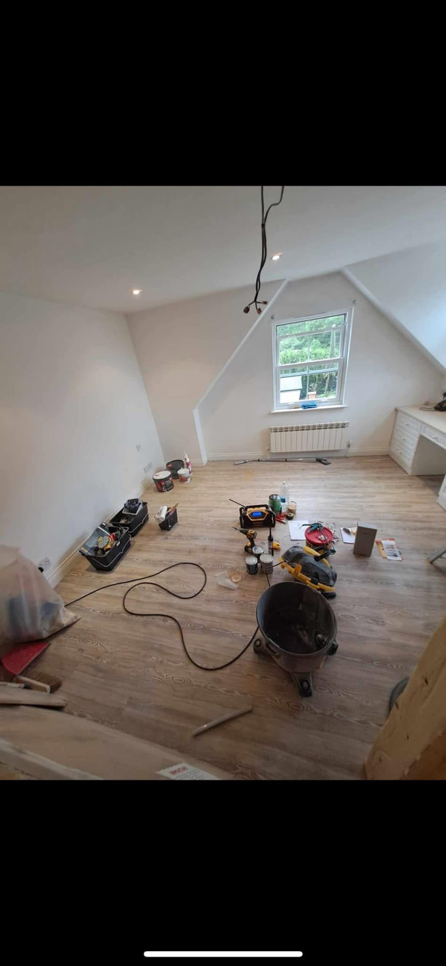 Bright, fully decorated bedroom with new flooring, lighting and fitted desk run