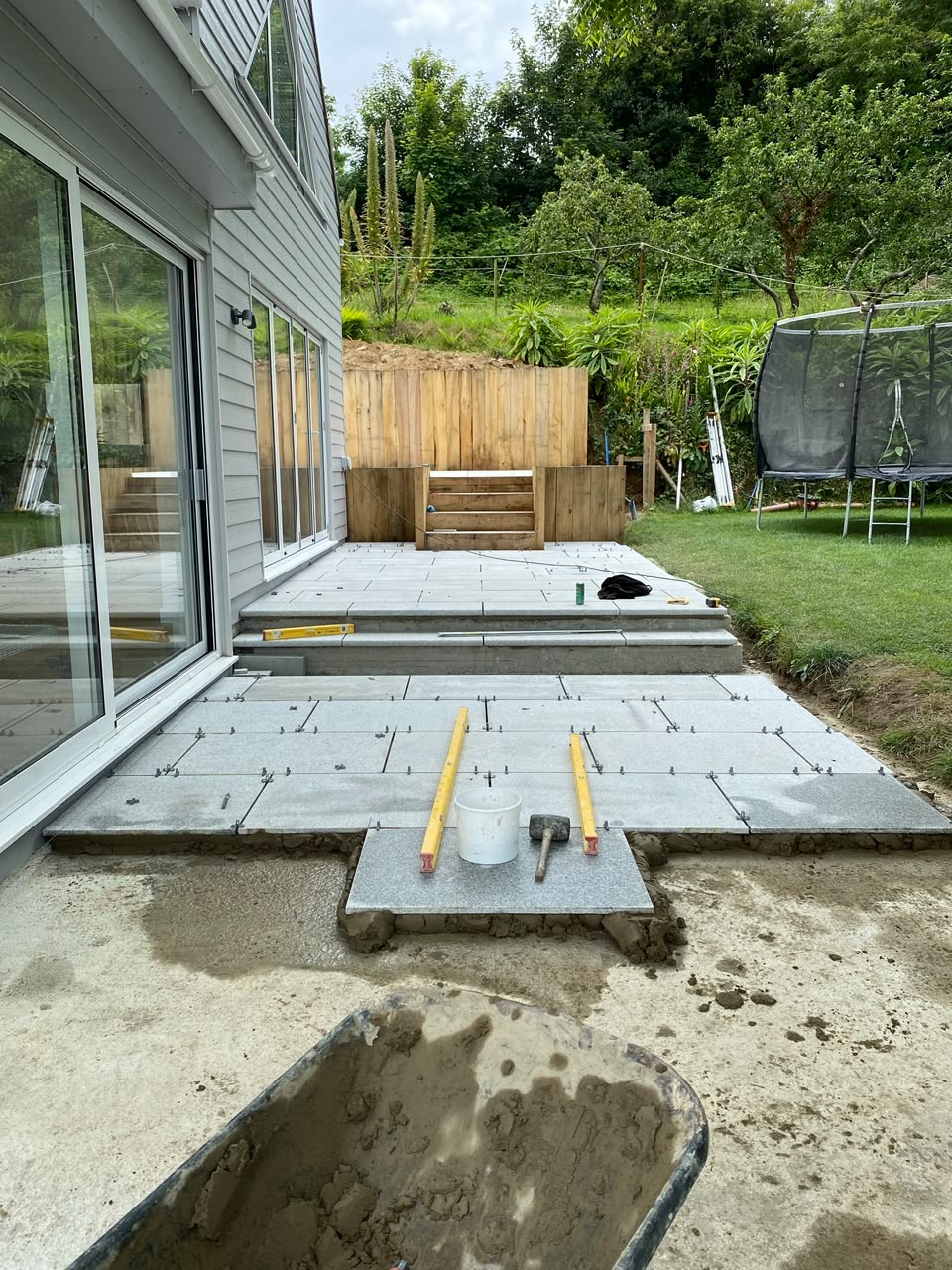 Before — Large-format granite being laid to fall
