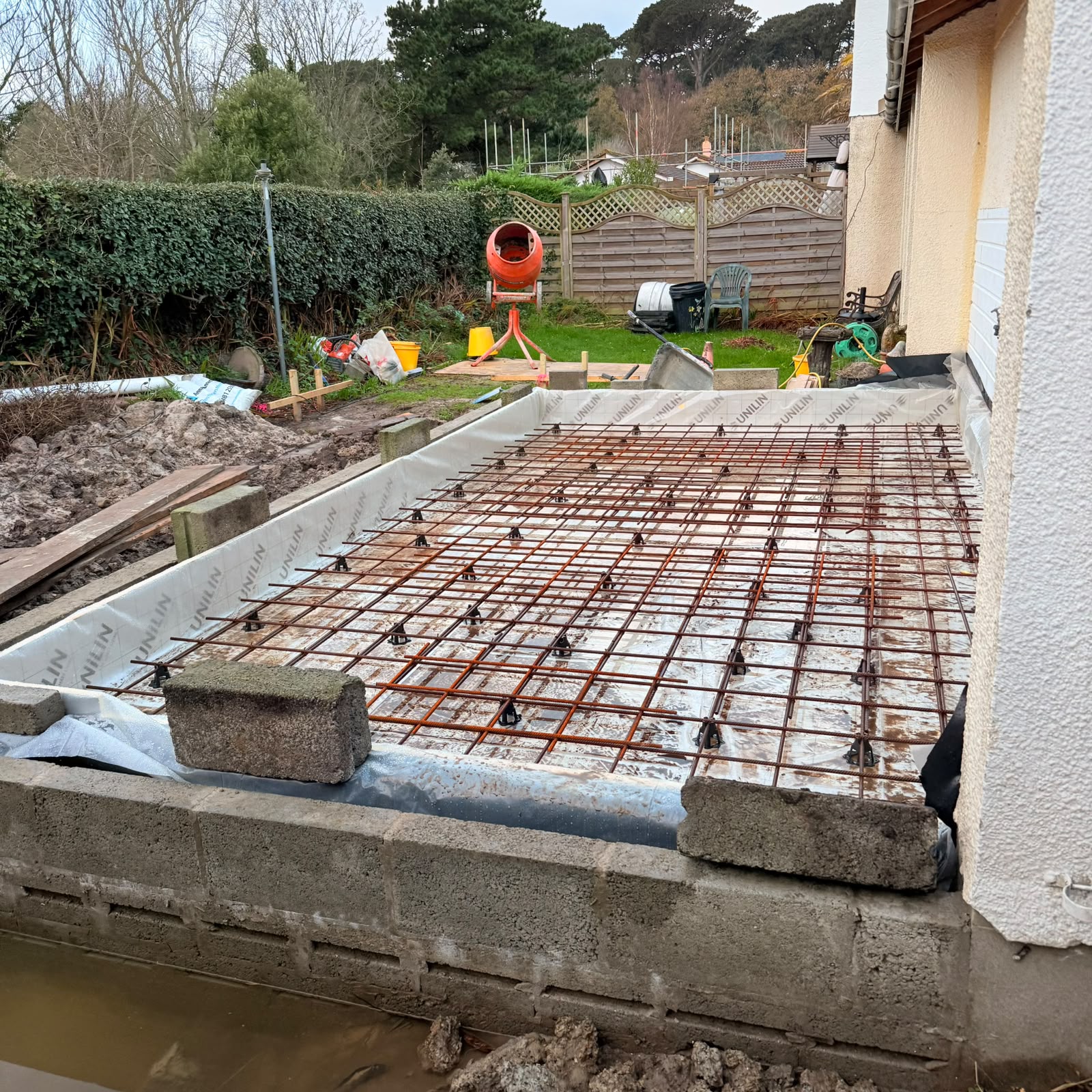 Insulated slab with reinforcement mesh laid ready for concrete