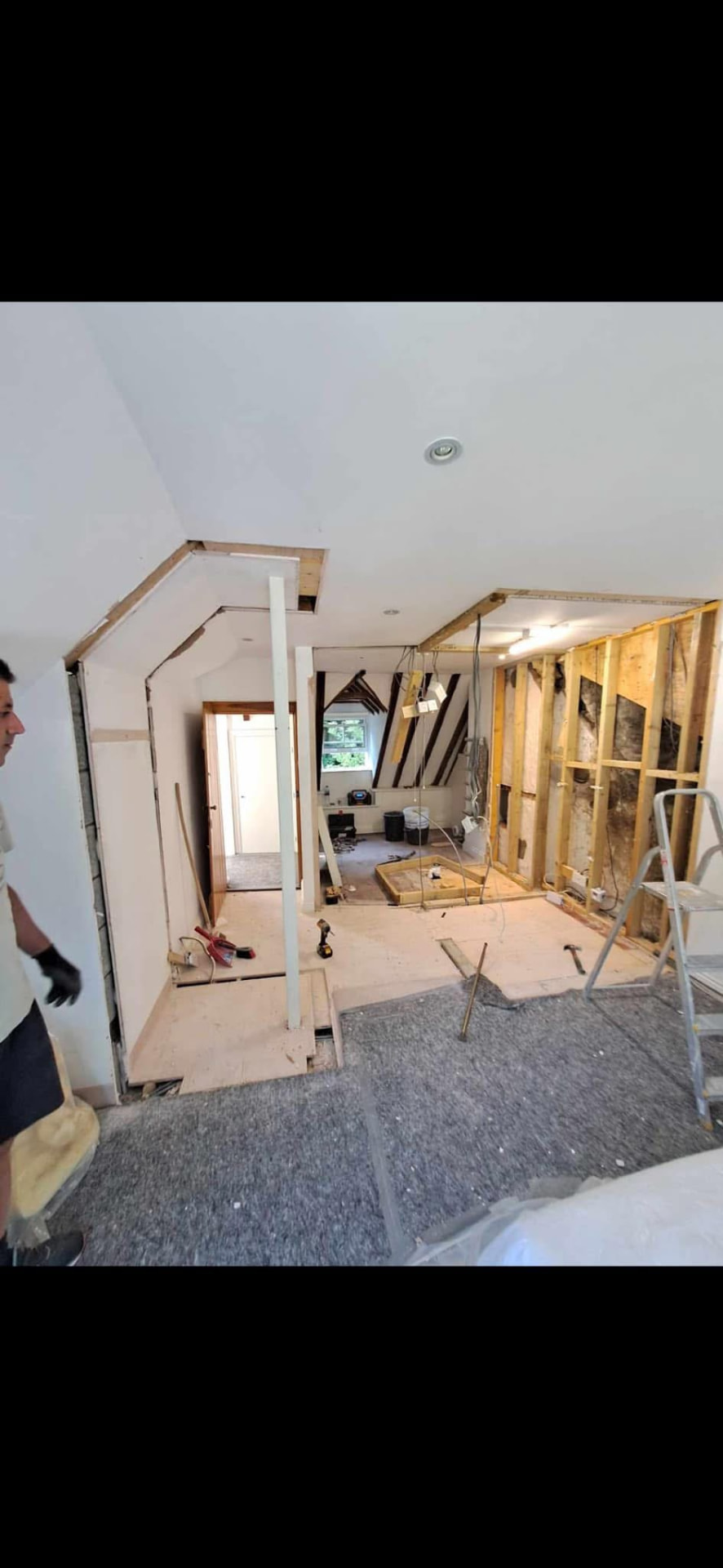Loft suite stripped out — partitions and linings removed ready for reconfiguration