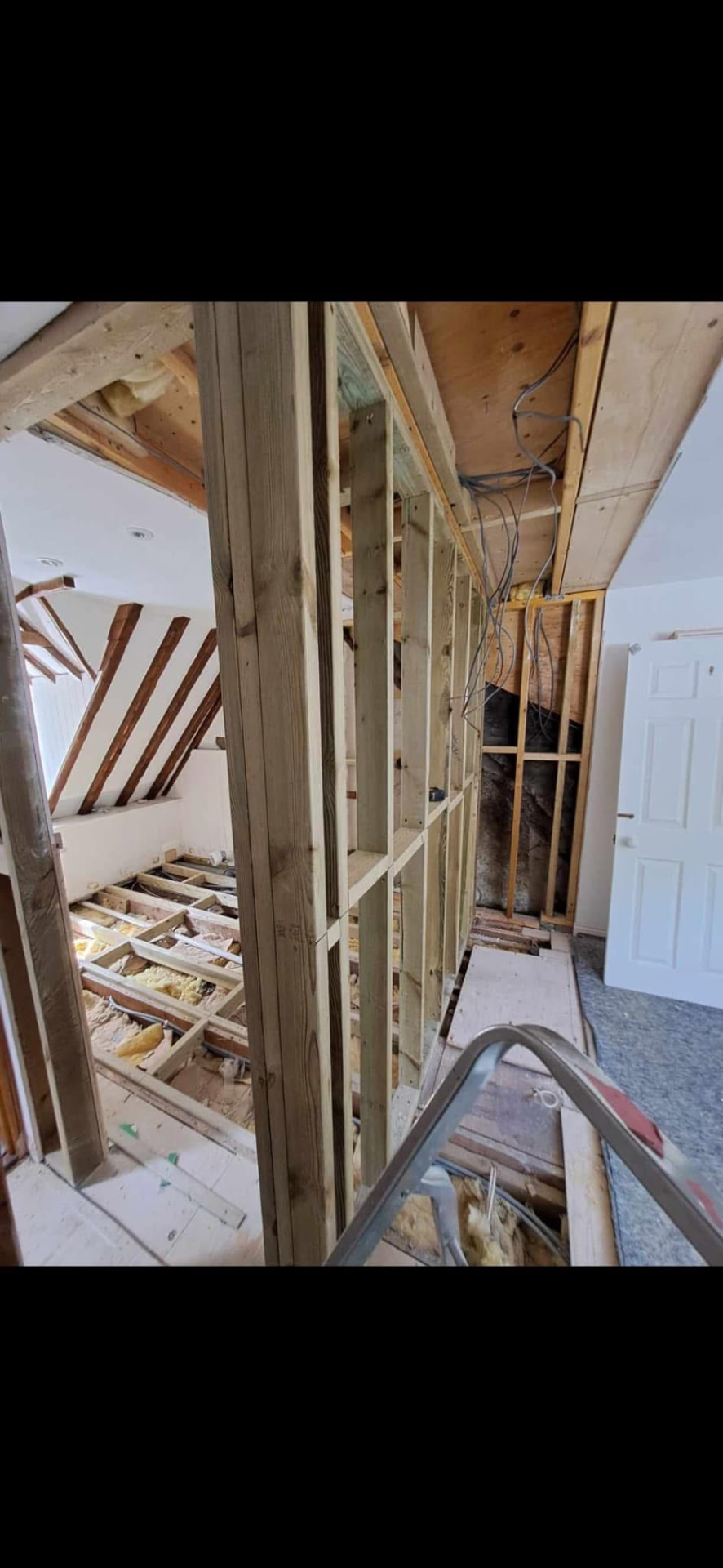 New timber stud partitions framed out with first fix electrics in place