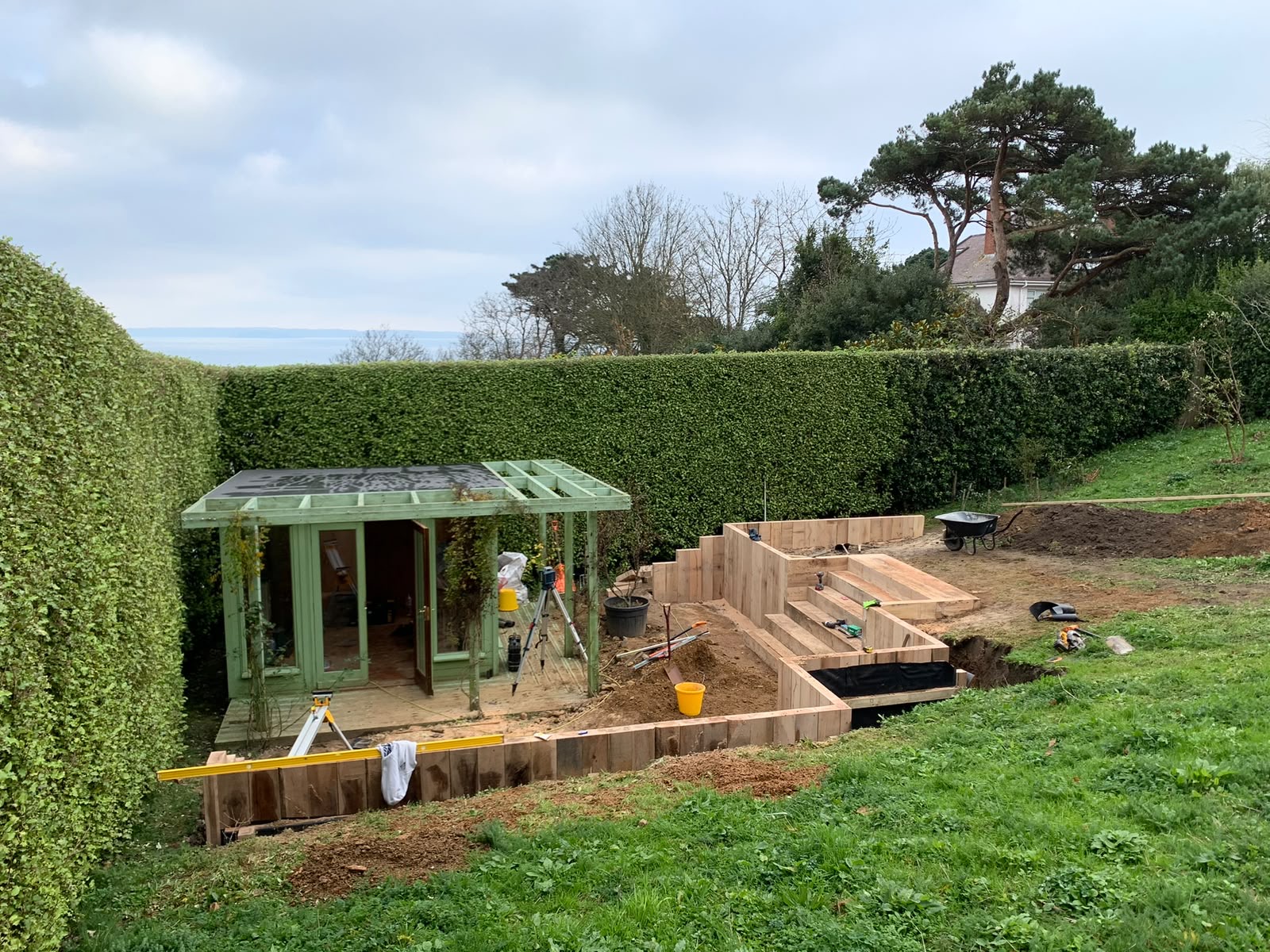 Sleeper walls and steps taking shape around the garden room