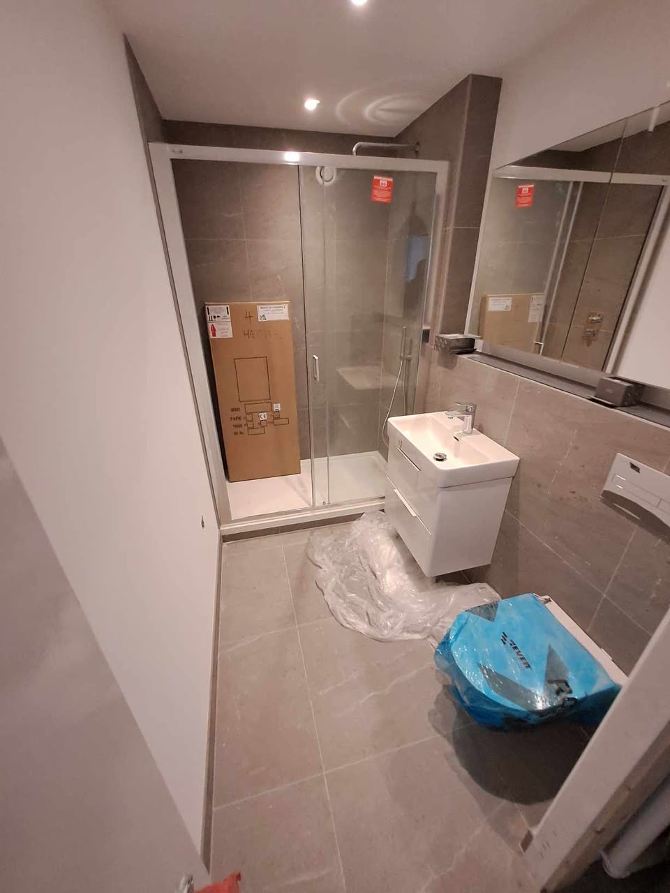 Second shower room finished in large-format stone-effect tiling