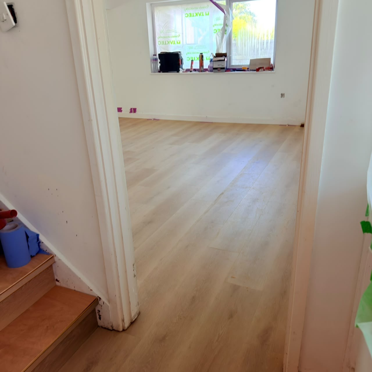 After — Seamless LVP flooring flowing through the ground floor