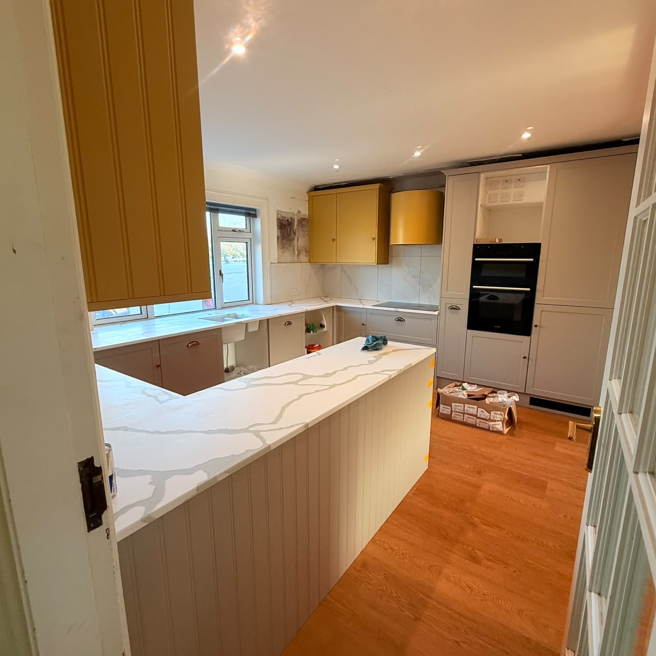 Quartz worktops and splashbacks installed throughout