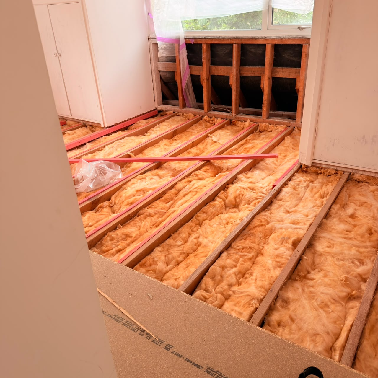 Before — Floors lifted — joists exposed and fully insulated