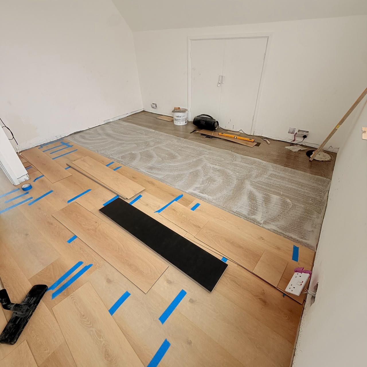 Before — Luxury Vinyl Plank being set out and laid