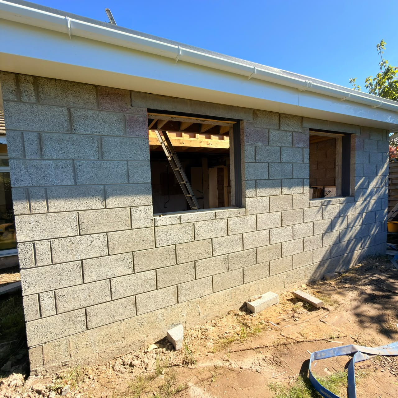 Side elevation with lintelled openings and guttering