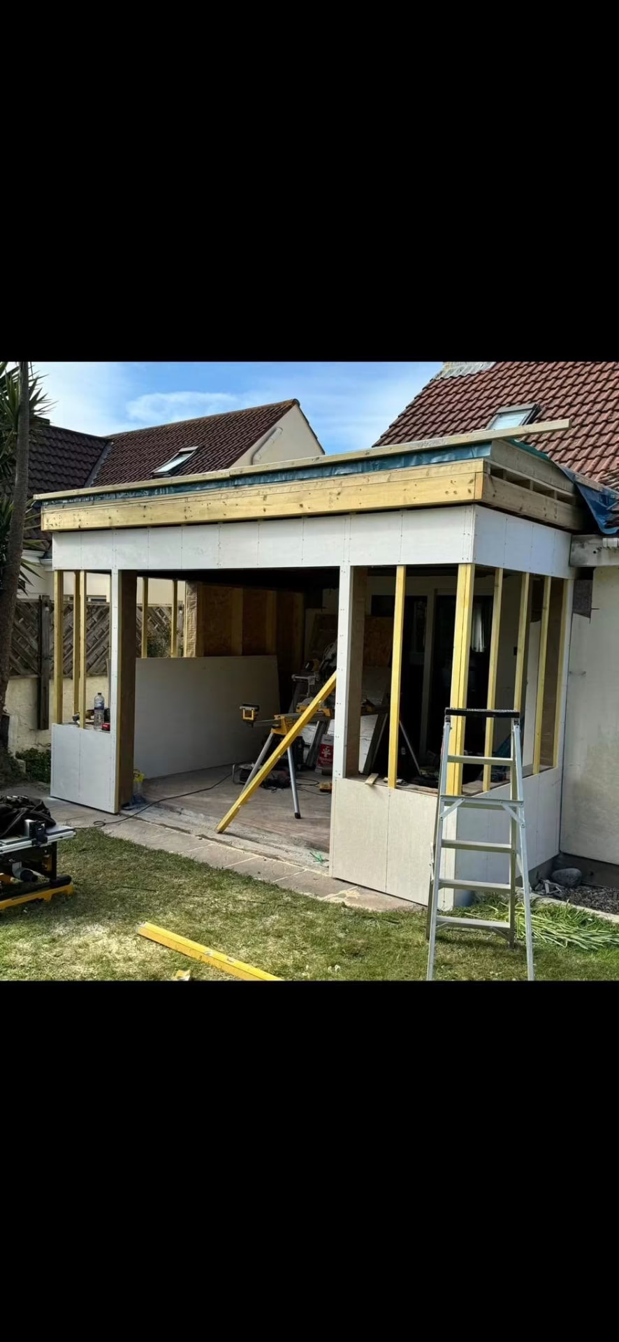 Before — Timber frame walls and roof deck complete, ready for cladding