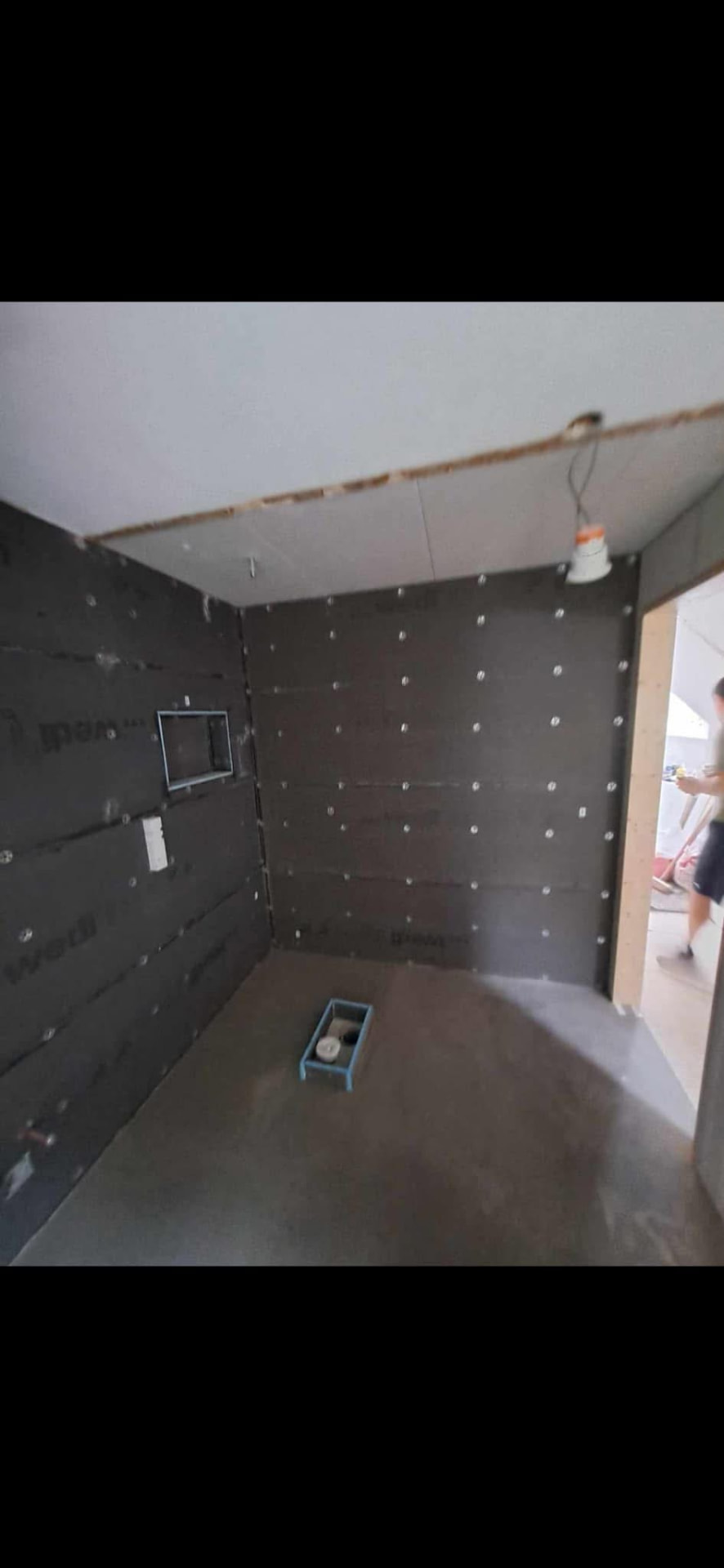 Waterproof tanking boards installed to the new walk-in shower enclosure