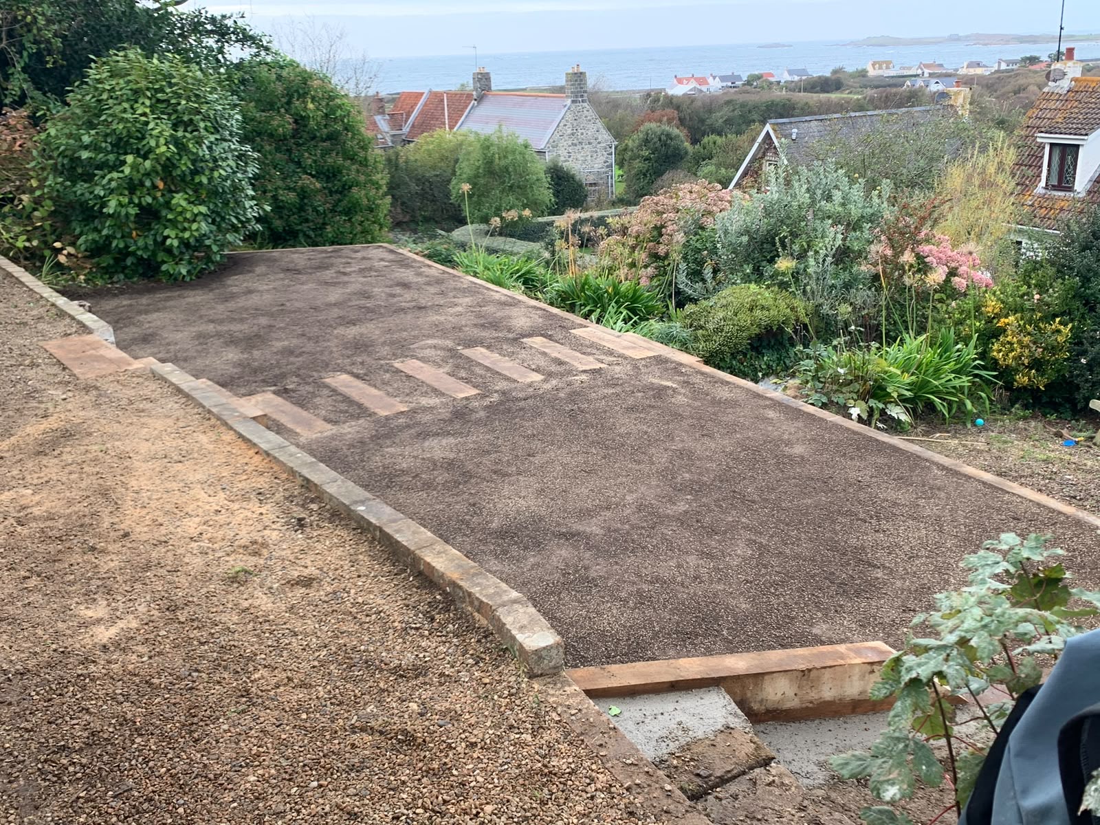 Level terrace prepared for turf with uninterrupted sea views