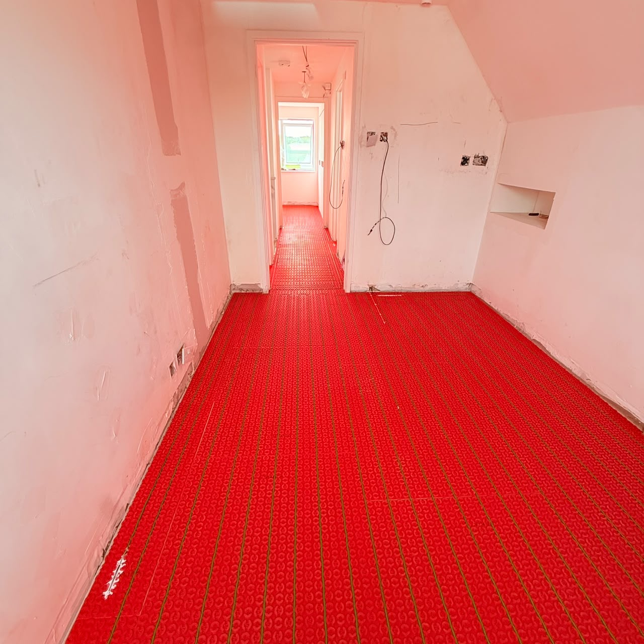 Before — Electric underfloor heating mats set out and tested