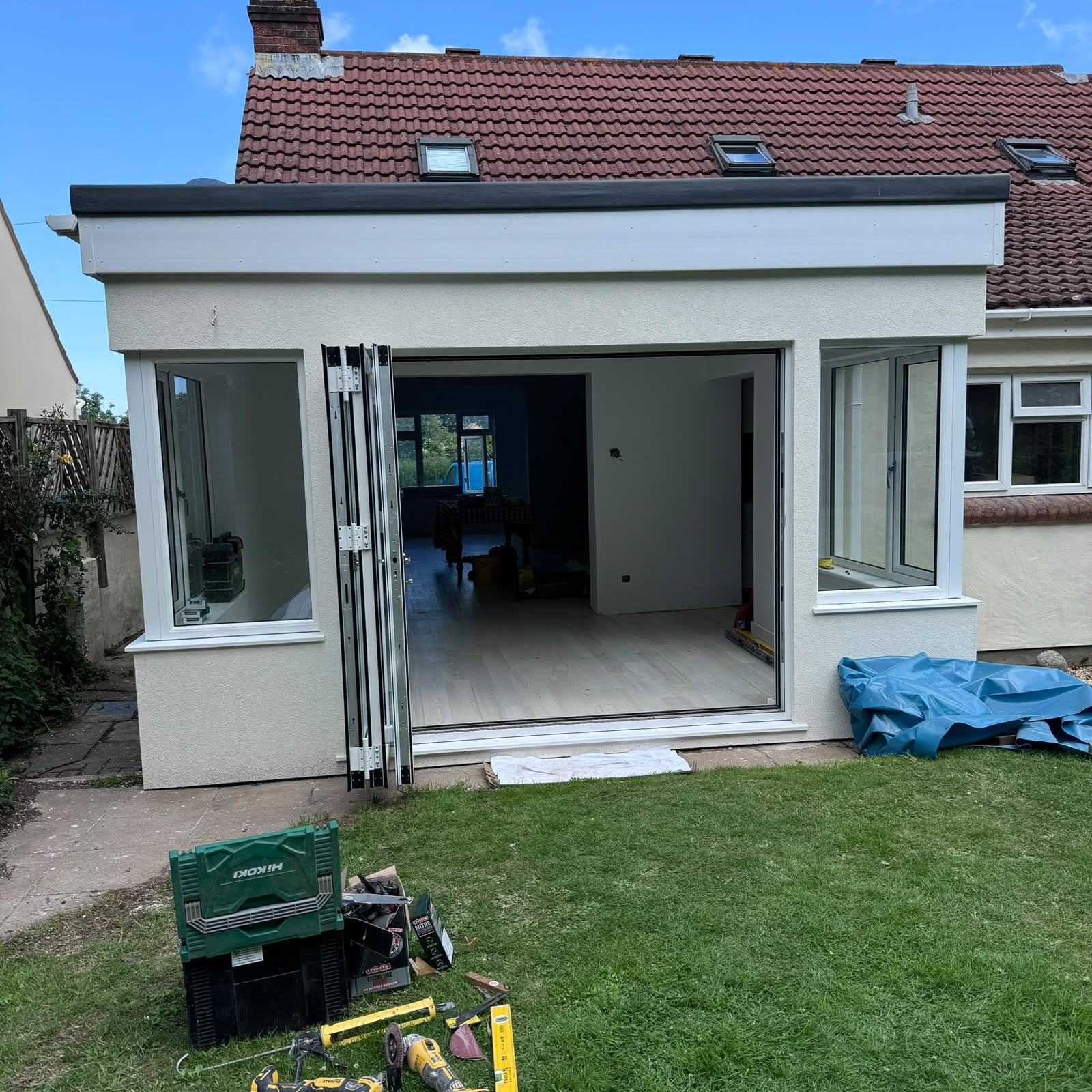 Completed contemporary single-storey rear extension with bi-fold doors, Guernsey