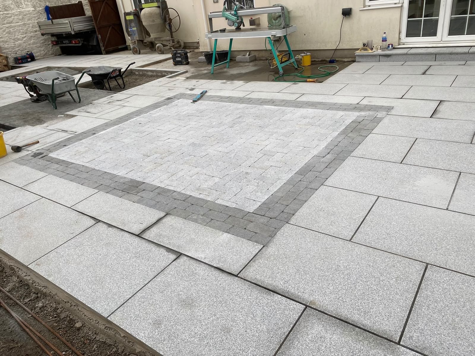 Setts and cropped granite laid out to form the feature inlay panel