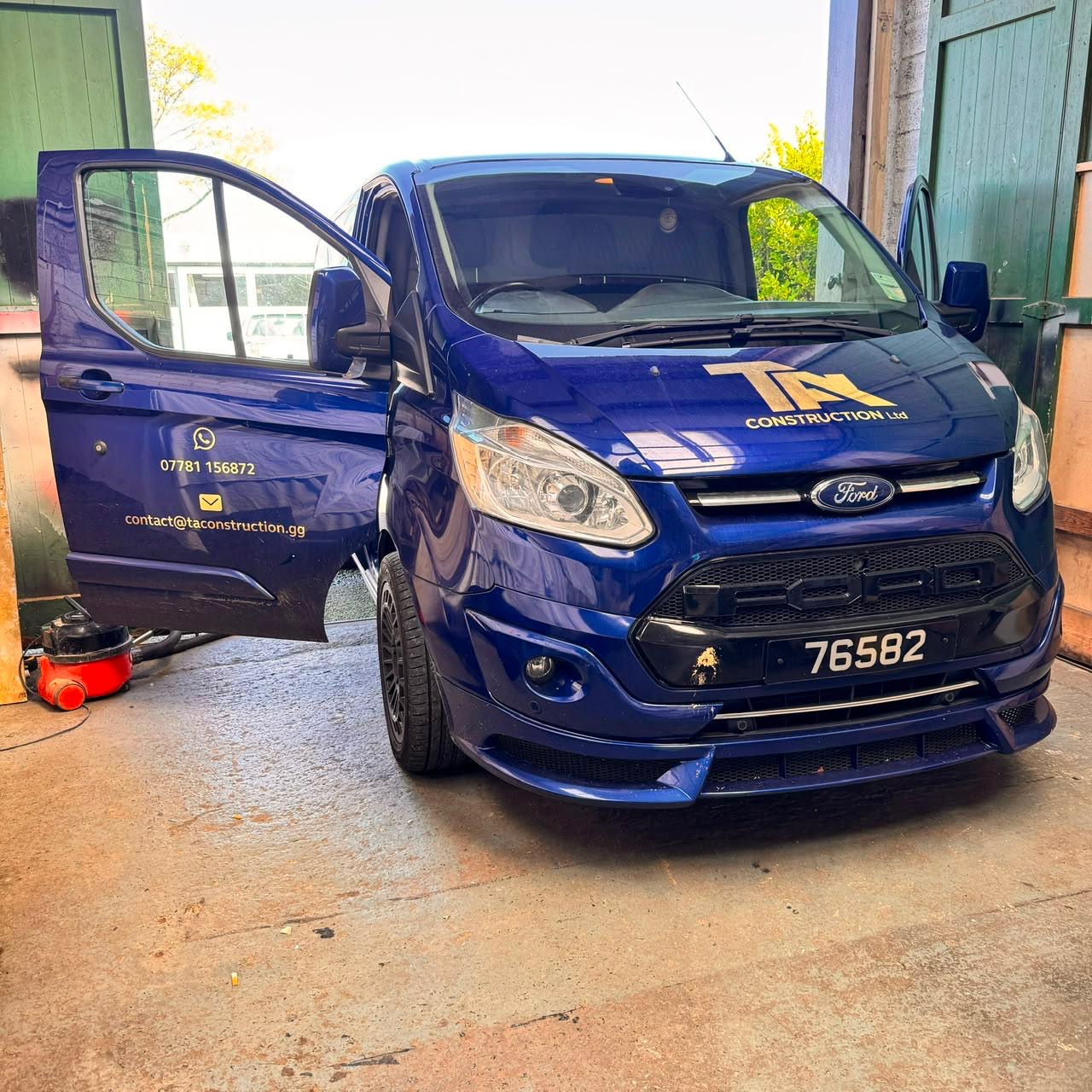 T.A. Construction Ltd van parked at a residential project