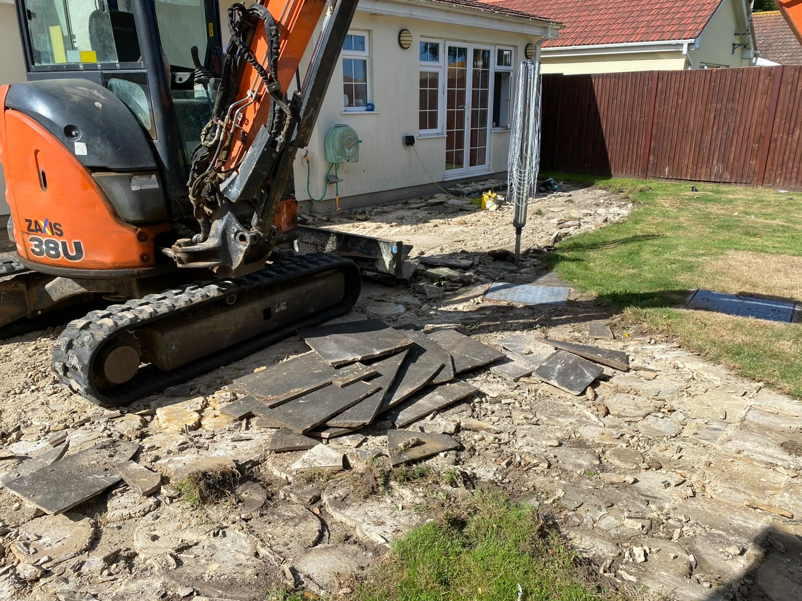 Old slabs lifted and broken out with the mini excavator