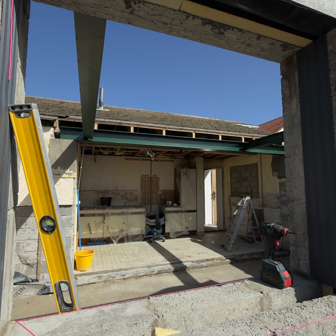 Structural steels installed over the new extension opening, Guernsey