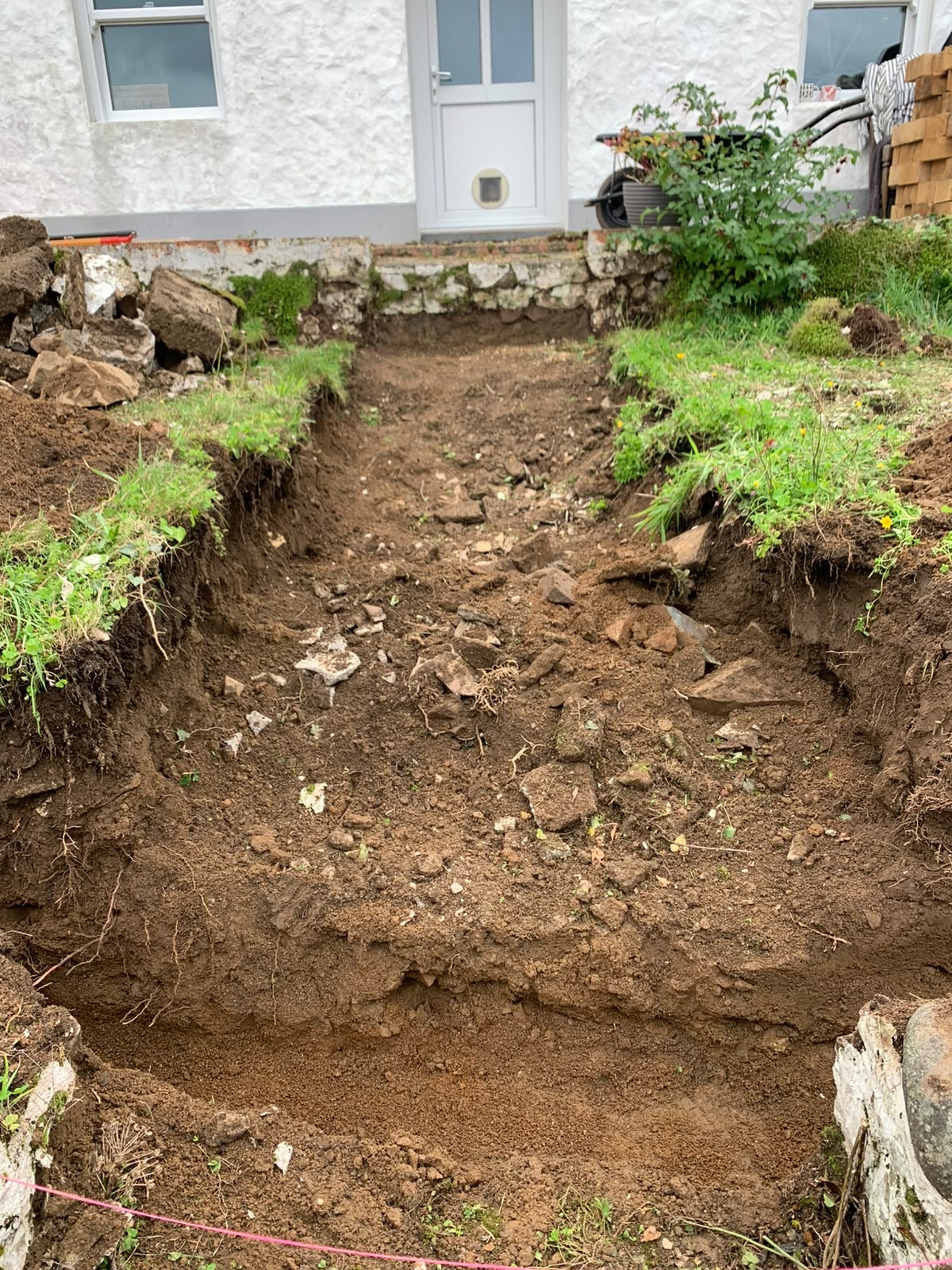 Pathway and step run excavated back towards the house