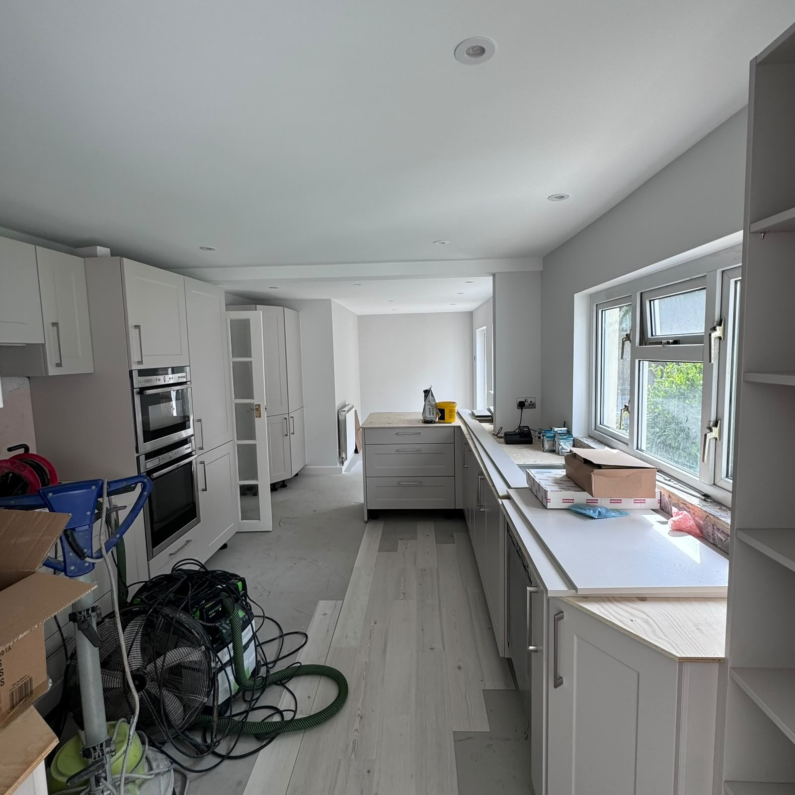 After — Kitchen run complete with new worktops and lighting